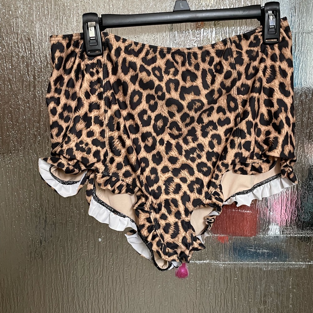 Kortni Jeane ruffled around cheetah swim bottoms